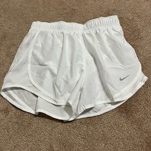 White Nike running shorts